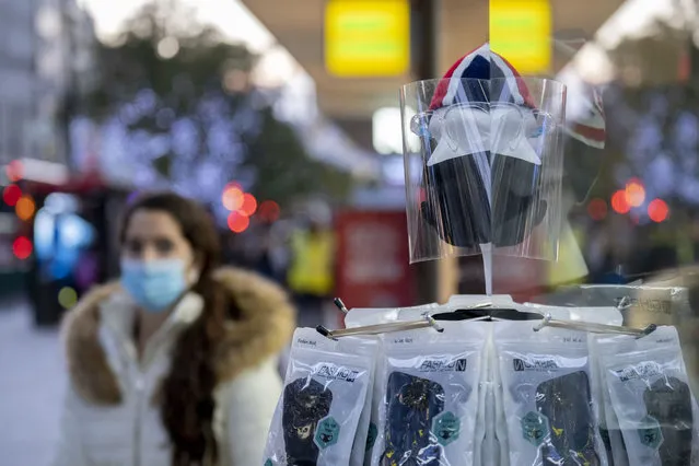 As the UK reacts to Prime Minister Boris Johnson's announcement of Lockdown 2 during the second wave of the Coronavirus pandemic, face shields and masks are on sale in a window of a retailer on Oxford Street, on 2nd November 2020, in London, England. From midnight on Thursday, all non-essential shops, bars, restaurants and other small businesses will have to closed, according to government Covid restrictions – and for a minimum of 4 weeks in the run-up to Christmas. (Photo by Richard Baker/In Pictures via Getty Images)