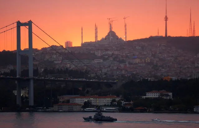 Russian Navy's Tarantul-class corvette Ivanovets is escorted by a Turkish Navy Coast Guard boat as it sets sail in the Bosphorus, on its way to the Black Sea, in Istanbul, Turkey, October 19, 2016. (Photo by Murad Sezer/Reuters)