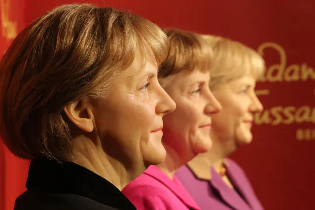 Three waxwork models of the country’s chancellor, Angela Merkel, on display at Madame Tussauds to mark the 10th anniversary of her time in office in Berlin, Germany on November 16, 2015. (Photo by Wolfgang Kumm/DPA/Corbis)
