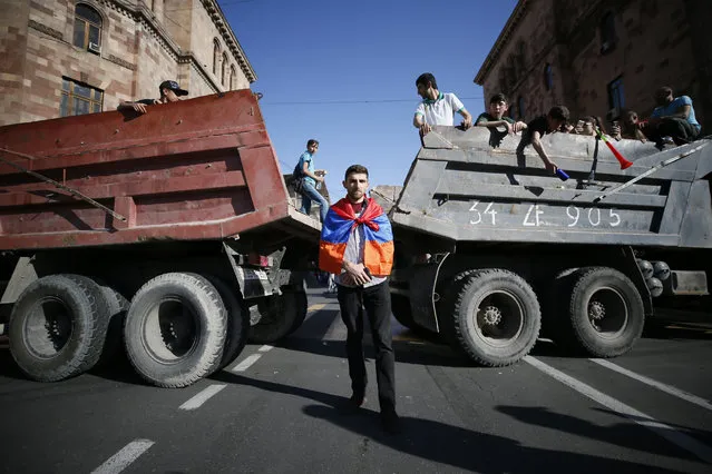 Armenian opposition supporters block the road after protest movement leader Nikol Pashinyan announced a nationwide campaign of civil disobedience in Yerevan, Armenia May 2, 2018. (Photo by Gleb Garanich/Reuters)