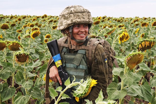 A servicewoman of the 65th Separate Mechanized Brigade of the Ukrainian Armed Forces attends a military drill near a frontline in Zaporizhzhia region, Ukraine on August 11, 2025. (Photo by Ukrainian Armed Forces via Reuters)
