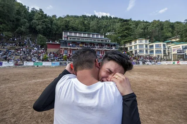 A Dhasa United player breaks down after his team won the final match of the Gyalyum Chenmo Memorial Gold Cup soccer tournament in Dharamshala, India, Sunday, June 11, 2023. Teams from different Tibetan settlements in exile participated in this 10-day-long annual tournament that ended Sunday. (Photo by Ashwini Bhatia/AP Photo)