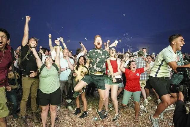 England fans celebrate as they win the penalty shoot out during the FIFA 2018 World Cup Finals match between Colombia and England at Brighton Lunar Beach on July 3, 2018 in Brighton, England. World Cup fever is building among England fans after reaching the Round of 16 in Russia. (Photo by Alan Crowhurst/Getty Images)