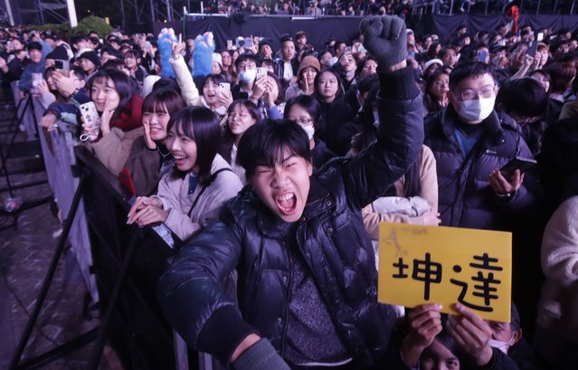 People cheer during the 2025 Taipei New Year's Party celebration in front of the Taipei City Government Building in Taipei, Taiwan, Tuesday, December 31, 2024. (Photo by Chiang Ying-ying/AP Photo)