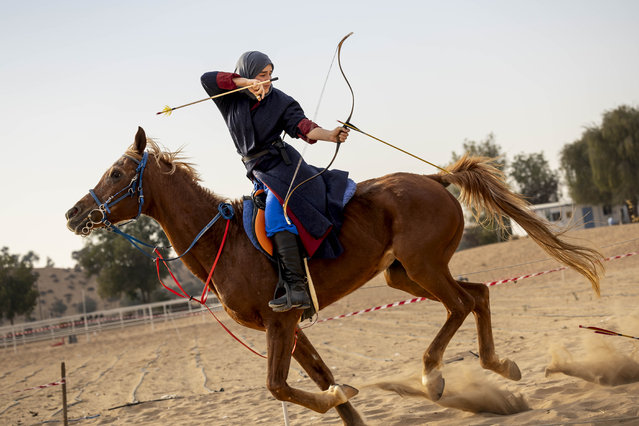 Maymunah Rodrigues shoots a ground target behind the horses pisition simulating an animal, for instance a lion, who would attack the rider and horse from the rear thus necesitating the rider to accurately fire an arrow while at full gallop during the Mamluk Games 2025 in Umm Al Quwain on January 27, 2025. (Phootr by Antonie Robertson/The National)