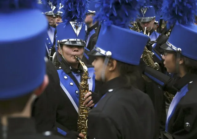 Members of a high school band practice before the start of the New Year's Day Parade in London, Britain January 1, 2016. (Photo by Neil Hall/Reuters)