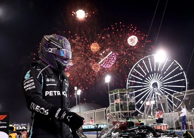 Race winner Lewis Hamilton of Great Britain and Mercedes GP celebrates in parc ferme during the F1 Grand Prix of Bahrain at Bahrain International Circuit on March 28, 2021 in Bahrain, Bahrain. (Photo by /Lars Baron/Reuters)