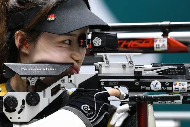 China's Zhao Ruozhu competes in the 10m air rifle mixed team shooting final during the 2018 Asian Games in Palembang on August 19, 2018. (Photo by Mohd Rasfan/AFP Photo)