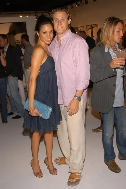 Meghan Markle and Trevor Engelson attend COACH Legacy Photo Exhibit by REED KRAKOFF at Coach on August 26, 2006 in East Hampton, NY. (Photo by Billy Farrell/Patrick McMullan via Getty Images)