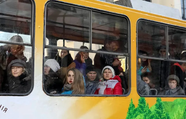 People pass by in a tram in central Lviv, Ukraine, November 24, 2016. (Photo by Gleb Garanich/Reuters)