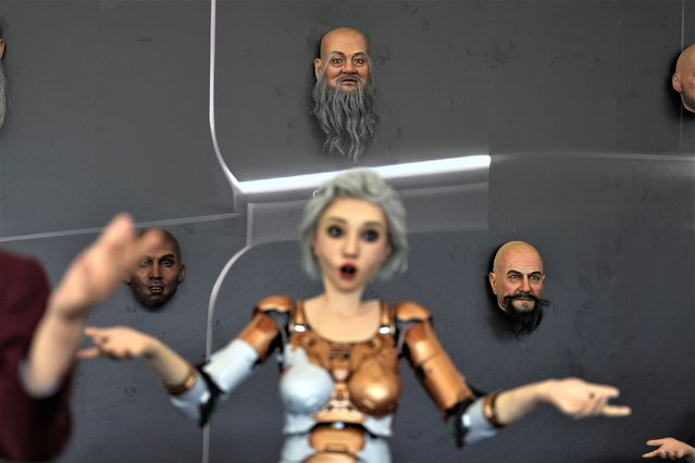 Human like robots and robotic faces that mimic human expressions are displayed at the annual World Robot Conference at the Beijing Etrong International Exhibition and Convention Center in Beijing, Wednesday, August 16, 2023. (Photo by Ng Han Guan/AP Photo)