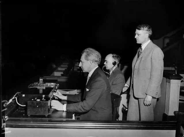 While his orchestra plays in Philadelphia, Leopold Stokowski, left, remotely balances the stereo sound from Constitution Hall in Washington, D.C., using the new control device developed by Bell Telephone Laboratories, April 27, 1933. Dr. Harvey Fletcher, right, of Bell Labs looks on as does W.B. Snow, center. Dr. Fletcher is known as the “father of stereophonic sound”. (Photo by AP Photo)