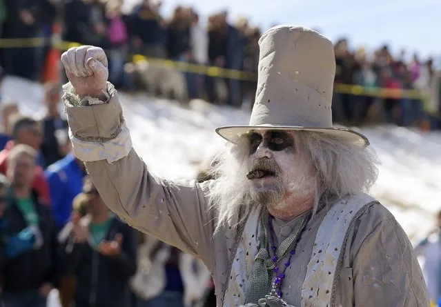 A man in costume cheers a team on in the Coffin Races at Frozen Dead Guy Days in Nederland, Colorado March 14, 2015. (Photo by Rick Wilking/Reuters)