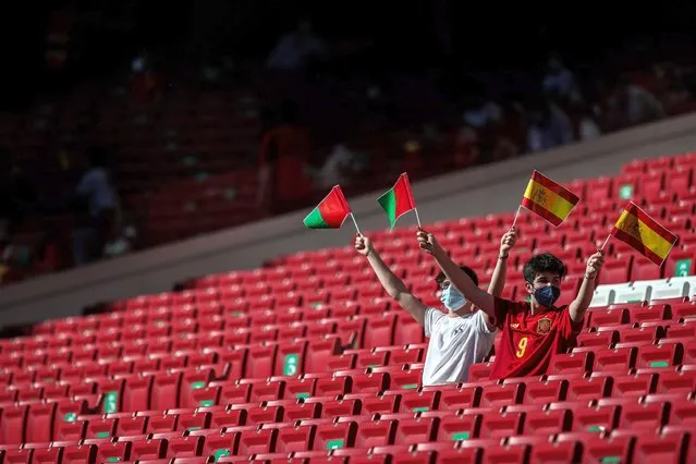 Supporters cheer before the international friendly soccer match between Spain and Portugal at Wanda Metropolitano stadium in Madrid, Spain​, 04 June 2021. (Photo by Mario Cruz/EPA/EFE)
