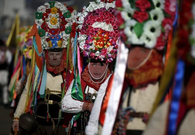 Participants in traditional costumes perform during the International Festival of the Masquerade Games in the town of Pernik, Bulgaria January 30, 2016. (Photo by Stoyan Nenov/Reuters)