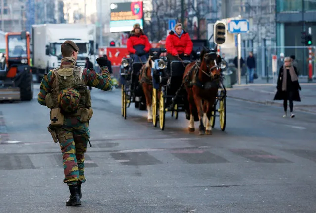 A Belgian soldier patrols ahead of New Year's celebrations in central Brussels, Belgium, December 30, 2016. (Photo by Francois Lenoir/Reuters)