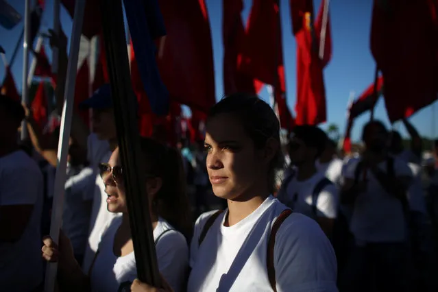 People march to mark the Armed Forces Day and commemorate the landing of the yacht Granma, which brought the Castro brothers, Ernesto “Che” Guevara and others from Mexico to Cuba to start the revolution in 1959, in Havana, Cuba, January 2, 2017. (Photo by Alexandre Meneghini/Reuters)