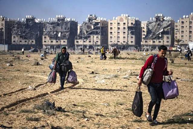 Palestinians flee from their neighbourhood in Khan Younis, Gaza Strip, during the ongoing Israeli bombardment, Saturday, December 2, 2023. (Photo by Fatima Shbair/AP Photo)