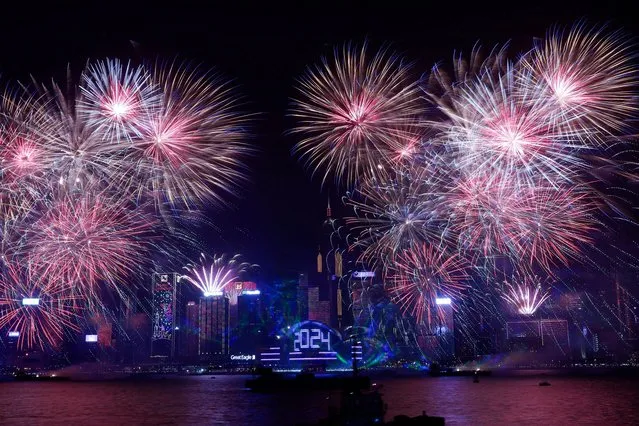 Fireworks explode over Victoria Harbour to celebrate the New Year in Hong Kong, China on January 1, 2024. (Photo by Tyrone Siu/Reuters)