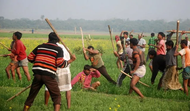 Activists of Bangladesh Jamaat-e-Islami party and Bangladesh Nationalist Party (BNP) attack an activist (bottom) of the Awami League during a clash in Rajshahi January 5, 2014. Bangladesh's ruling Awami League was poised on Sunday to win a violence-plagued parliamentary election whose outcome was never in doubt after a boycott by the main opposition party. (Photo by Reuters/Stringer)