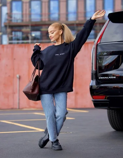 American singer-songwriter Ariana Grande strikes a pose in NYC on January 4, 2024 wearing crewneck which fans believe holds a clue to her new single. (Photo by Diggzy/Shutterstock/Splash News and Pictures)
