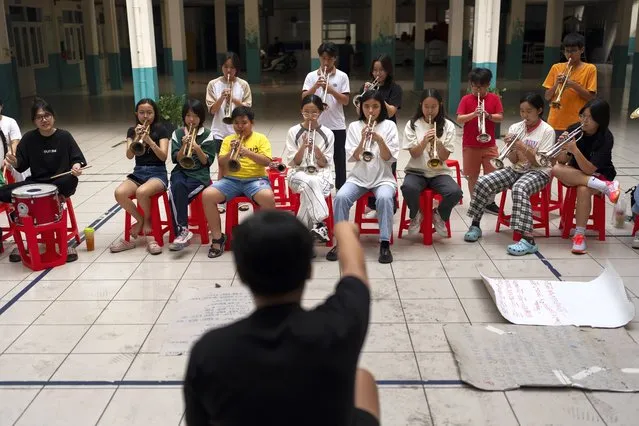 Secondary school band members rehearse for an event in Ho Chi Minh City, Vietnam, January 14, 2024. (Photo by Jae C. Hong/AP Photo)