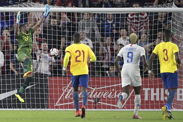 A kick by United States forward Gyasi Zardes (9) gets past Ecuador goalkeeper Alexander Dominguez (22) for a score during the second half of an international friendly soccer match Thursday, March 21, 2019, in Orlando, Fla. (Photo by Phelan M. Ebenhack/AP Photo)