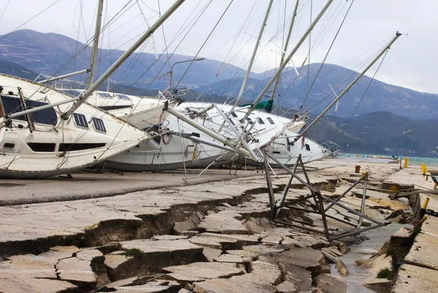 Yachts  are seen knocked off their stands at a damaged dock after an earthquake in Lixouri  on the island of Kefalonia, western Greece on Monday, February 3, 2014. A strong earthquake with a preliminary magnitude between 5.7 and 6.1 hit the western Greek island of Kefalonia before dawn Monday, sending scared residents into the streets just over a week after a similar quake damaged hundreds of buildings, reviving memories of a disaster in the 1950s. (Photo by AP Photo)