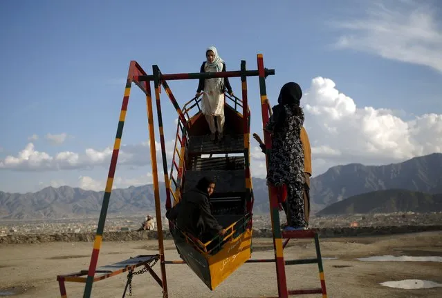 Afghan girls play on a swing in Kabul, Afghanistan March 7, 2016. (Photo by Ahmad Masood/Reuters)