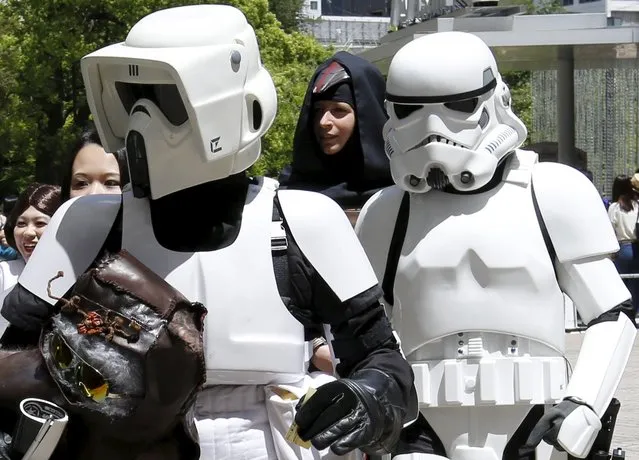 Cosplayers dressed up as Star Wars characters Scout Trooper (L) and Storm Trooper take part in a Star Wars Day fan event in Tokyo May 4, 2015. (Photo by Toru Hanai/Reuters)