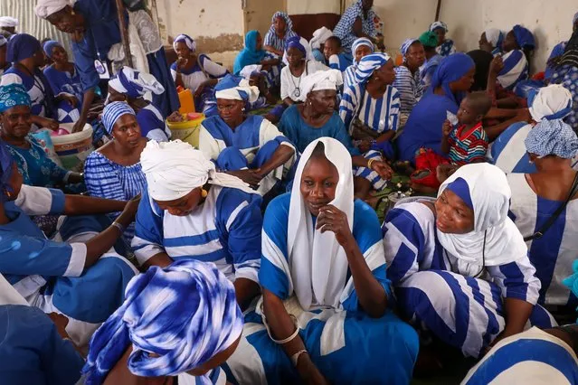 A view of followers of the Baye Fall movement, which is considered as a different and contradictory interpretation of the Muridi sect gather as they cook mass meals and pray to commemorate the day in which the founder of the Mouridism, Sheikh Ahmadou Bamba, and his first disciple and founder of the Baye Fall movement Mame Ibrahim Fall met, during the 20th day of Ramadan in Touba, Senegal on March 31, 2024. (Photo by Cem Ozdel/Anadolu via Getty Images)