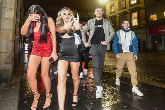 Bare legs, strappy sandals, and tiny dresses is the dress code for girls in Newcastle, United Kingdom on Sunday, December 26, 2021. Glammed up Brits hit the clubs on Boxing Day night amid fears it could be one of the last opportunities to get dressed up for a while amid New Year lockdown concerns. (Photo by Newcastle New Projects)