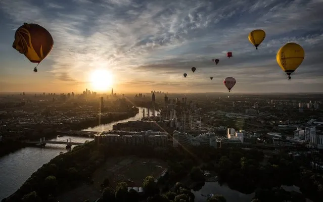 Hot air balloons fly over London as a part of the Lord Mayor's Hot Air Balloon Regatta, in London, June 9, 2019. (Photo by Jeff Gilbert/The Telegraph)