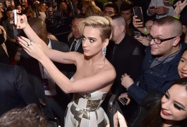 Singer Katy Perry (C) takes a selfie with fans at the 2017 iHeartRadio Music Awards which broadcast live on Turner's TBS, TNT, and truTV at The Forum on March 5, 2017 in Inglewood, California. (Photo by Frazer Harrison/Getty Images for iHeartMedia)