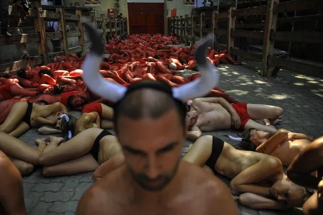 People protest against bull runs beside the bull ring a few days ahead to beginning the famous San Fermin Fiestas,  in Pamplona northern Spain, Saturday, July 4, 2015. (Photo by Alvaro Barrientos/AP Photo)