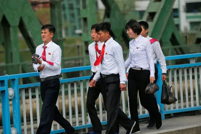 Students cross a bridge in central Pyongyang, North Korea May 4, 2016. (Photo by Damir Sagolj/Reuters)