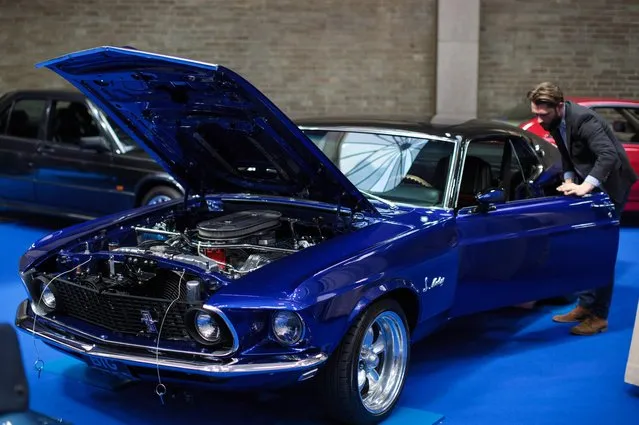A man inspects a 1969 Ford Mustang Mach 1(estimate £38,000 - £42,000) inside the Royal Horticultural Halls on April 11, 2017 in London, England. (Photo by Jack Taylor/Getty Images)