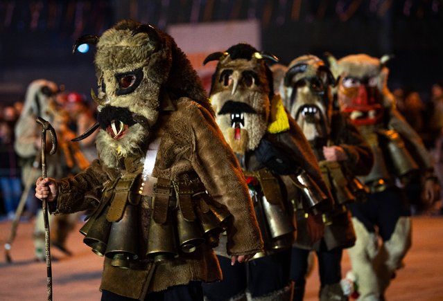 Members of carnival groups perform during a carnival procession of the closing carnival night in the town of Strumica, southeastern North Macedonia, 25 February 2023. North Macedonians are marking Trimery, an Orthodox Christian holiday, when evil spirits are chased away with dance rituals. The holiday marks the beginning of the fasting period ahead of Easter. (Photo by Georgi Licovski/EPA/EFE/Rex Features/Shutterstock)