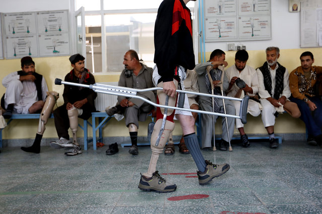 An Afghan man learns how to walk with his new prosthetic at the International Committee of the Red Cross (ICRC) physical rehabilitation center in Kabul, Afghanistan, Tuesday, May 10, 2016. Afghanistan is one of the world's most heavily mined countries. (Photo by Rahmat Gul/AP Photo)
