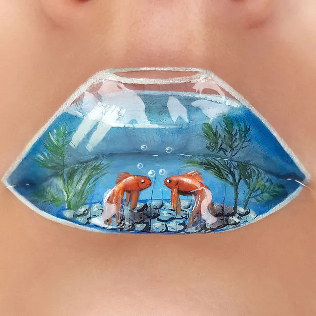 Tutushka's lipstick art work on her lips showing a fish bowl. (Photo by Tutushka Matviienko/Caters News Agency)