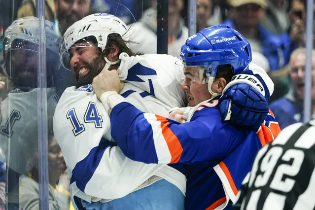 New York Islanders' Ross Johnston, right, punches Tampa Bay Lightning's Pat Maroon during the first period of an NHL hockey game Sunday, March 27, 2022, in Elmont, N.Y. (Photo by Frank Franklin II/AP Photo)
