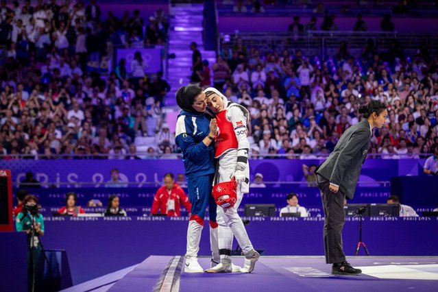 Nahid Kiani of Iran is consoled after being defeated by Yuin Kim of South Korea in their women’s 57kg Taekwondo gold medal bout at the 2024 Paris Olympics on August 8, 2024. (Photo by Ed Alcock/The Guardian)