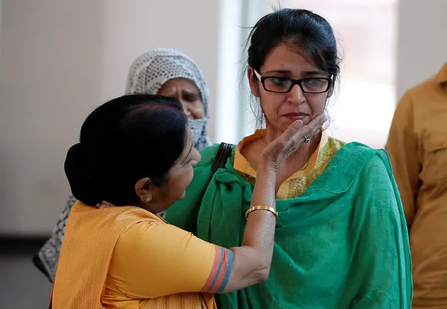 India's External Affairs Minister Sushma Swaraj consoles Uzma, an Indian woman who according to local media was forced to marry a Pakistani man, after her arrival, in New Delhi, India May 25, 2017. (Photo by Adnan Abidi/Reuters)