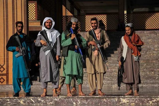 Taliban stand guard outside a mosque during Eid al-Fitr prayers in Kabul, Afghanistan, 01 May 2022. Muslims around the world celebrate Eid al-Fitr, the three day festival marking the end of Ramadan. Eid al-Fitr is one of the two major holidays in the Islamic calendar. (Photo by EPA/EFE/Stringer)