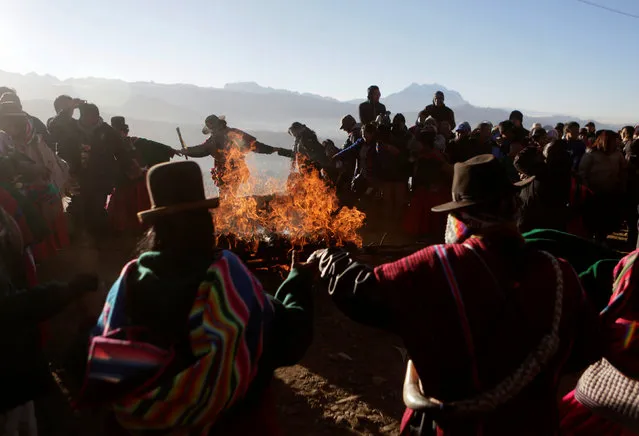 Bolivian indigenous people celebrate Aymara New Year during a ceremony in El Alto near La Paz, Bolivia, June 21, 2016. (Photo by David Mercado/Reuters)