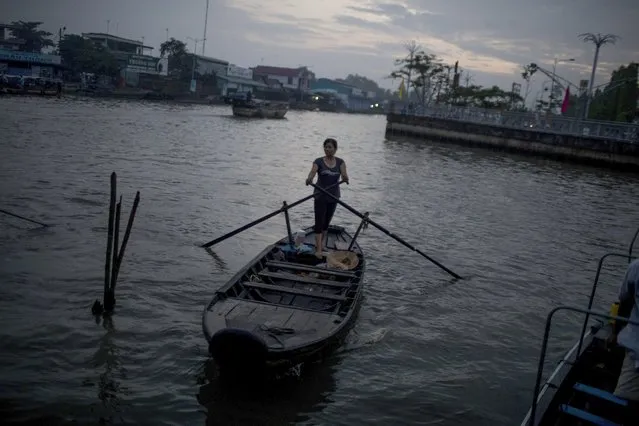 The floating market where many farmers make their livelihood selling produce in Nga Nam District, Soc Trang Province, Vietnam, May 18, 2016. The Mekong Delta, Vietnam's premier rice growing region, is suffering its worst drought since at least 1926, and saline water has swept farther up the delta than ever. (Photo by The New York Times)