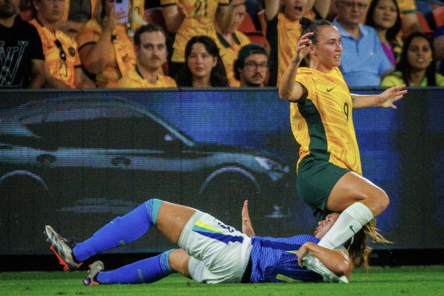 Australia's Caitlin Foord (R) and Brazil's Vitoria Calhau (R) collide during the women's international football friendly match between Australia and Brazil at Suncorp Stadium in Brisbane on November 28, 2024. (Photo by Patrick Hamilton/AFP Photo)