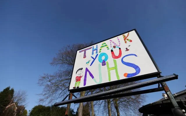 A drawing made by children thanking the National Health Service, as the spread of coronavirus disease (COVID-19) continues. Newcastle-under-Lyme, Britain, March 25, 2020. (Photo by Carl Recine/Reuters)