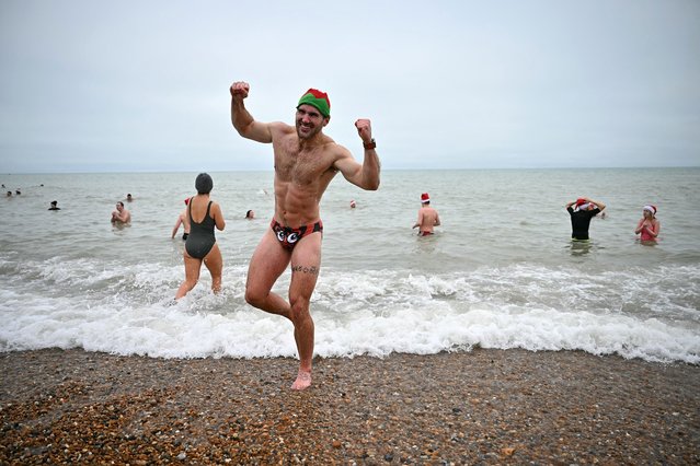 Participants take part in a Christmas day swim in the sea at Brighton beach, southern England on December 25, 2024. (Photo by Ben Stansall/AFP Photo)