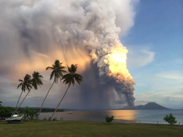 A photo taken on August 29, 2014, shows Mount Tavurvur erupting in eastern Papua New Guinea, spewing rocks and ash into the air, forcing the evacuation of local communities and international flights to be re-routed. Mount Tavurvur, which destroyed the town of Rabaul when it erupted simultaneously with nearby Mount Vulcan in 1994, rumbled to life early in the morning on the tip of the remote island of New Britain. (Photo by Oliver Bluett/AFP Photo)